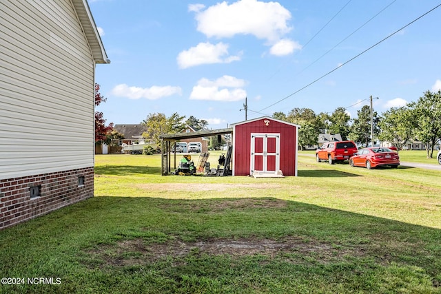 view of yard featuring an outbuilding and a shed