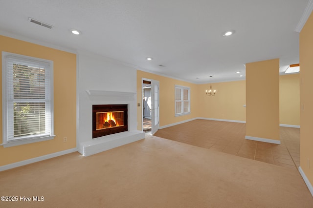 unfurnished living room with light tile patterned floors, visible vents, an inviting chandelier, a brick fireplace, and light carpet