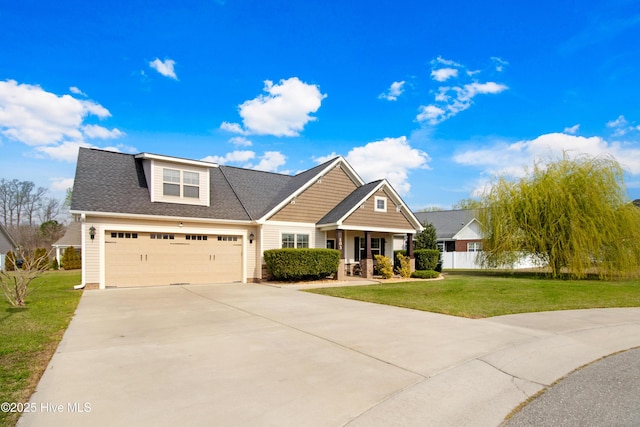 craftsman-style home featuring roof with shingles, a porch, a garage, driveway, and a front lawn