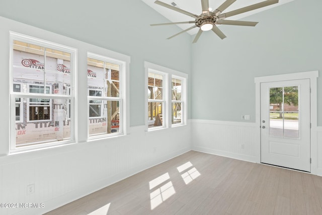 unfurnished sunroom with a ceiling fan