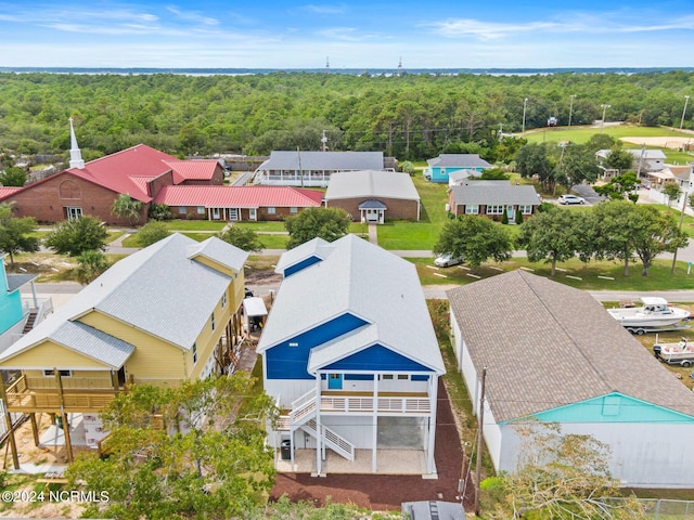 birds eye view of property with a forest view and a residential view