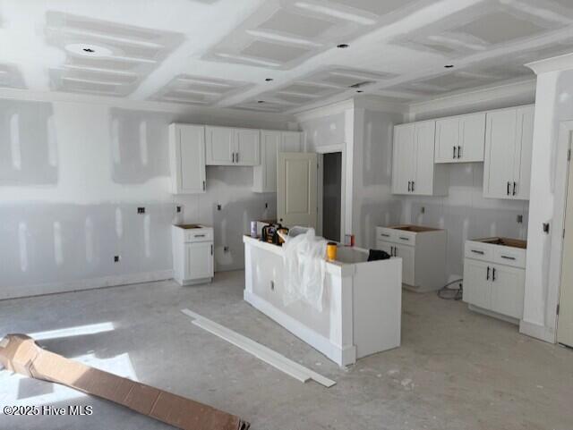 kitchen with white cabinets and a center island