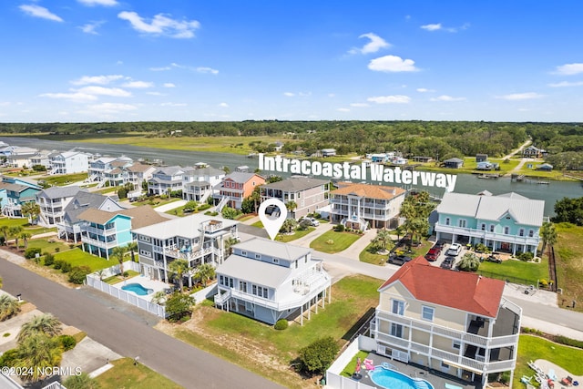 drone / aerial view with a water view and a residential view