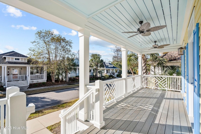 deck featuring a ceiling fan and covered porch