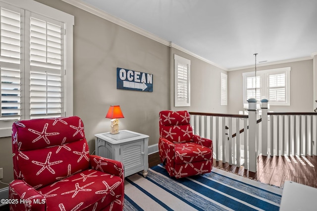 6430 Craller Way, Ocean Isle Beach, NC 28469 - sitting room featuring crown molding, wood finished floors, baseboards, and an upstairs landing