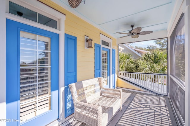 balcony featuring a ceiling fan and covered porch