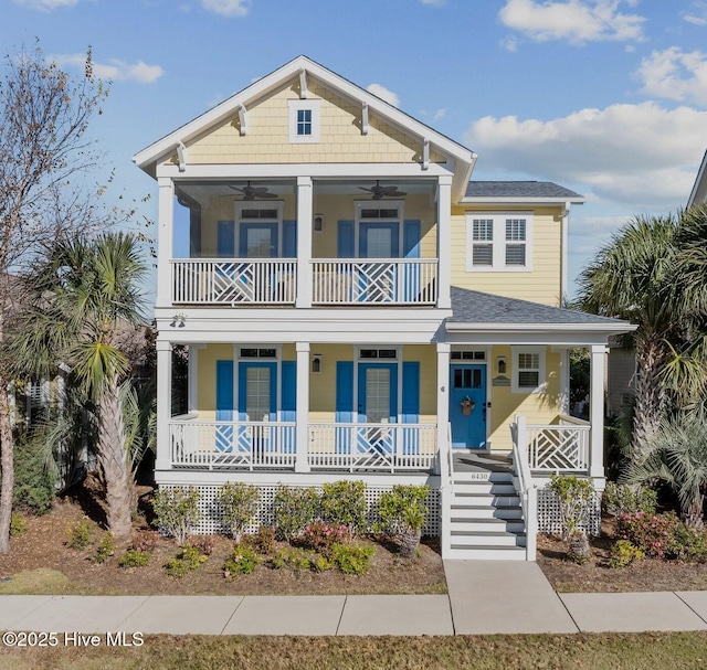 6430 Craller Way, Ocean Isle Beach, NC 28469 - view of front of home featuring covered porch, a balcony, ceiling fan, and roof with shingles