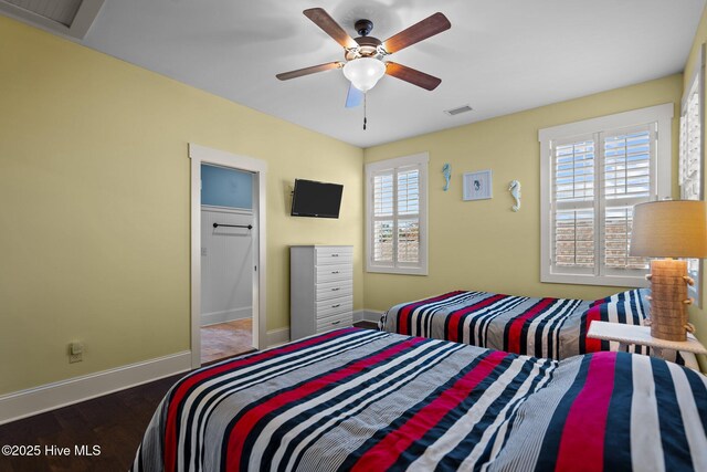 6430 Craller Way, Ocean Isle Beach, NC 28469 - bedroom with baseboards, wood finished floors, and a ceiling fan