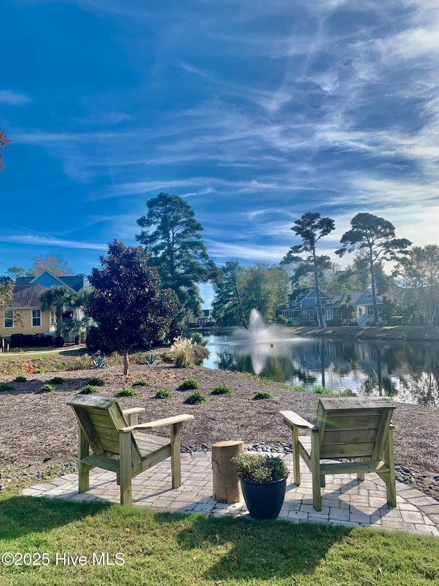 view of community with a water view