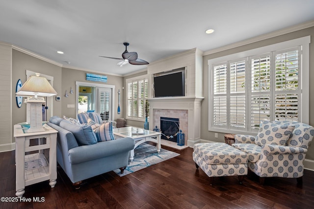 6430 Craller Way, Ocean Isle Beach, NC 28469 - living room featuring wood-type flooring, ceiling fan, ornamental molding, a fireplace with flush hearth, and baseboards