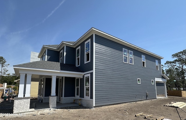 3927 Watersail Dr Unit 93, Wilmington, NC 28409 - view of side of property with a porch and a shingled roof