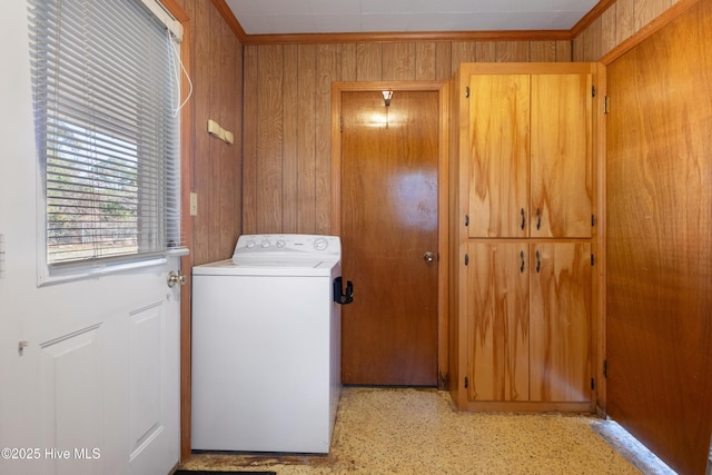 laundry area with crown molding, laundry area, washer / clothes dryer, and wooden walls