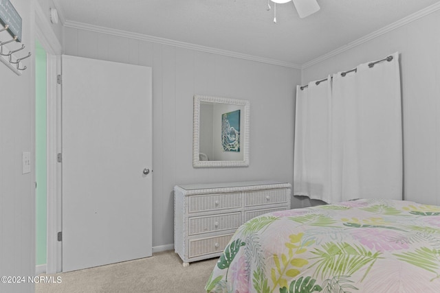 bedroom with carpet flooring, crown molding, and ceiling fan