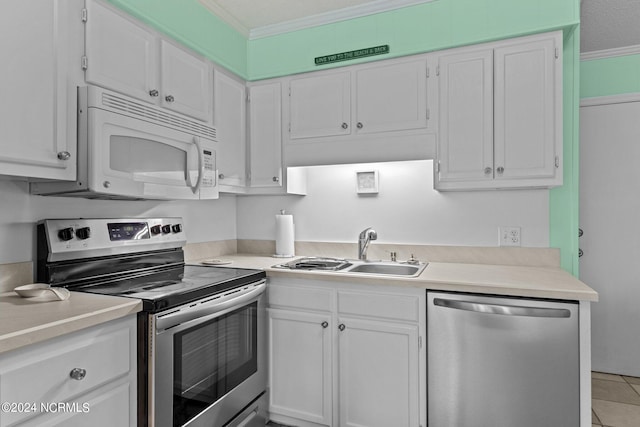 kitchen with stainless steel appliances, crown molding, light countertops, white cabinetry, and a sink