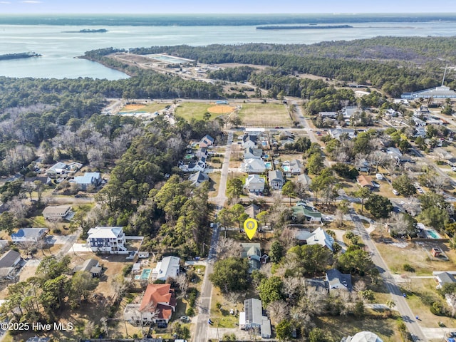 aerial view with a water view and a view of trees