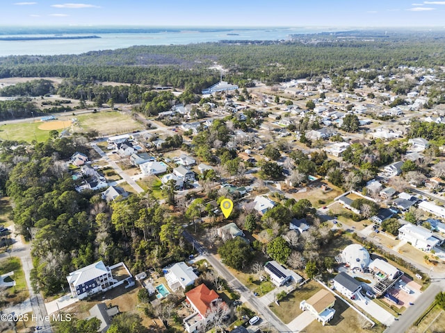 bird's eye view featuring a wooded view