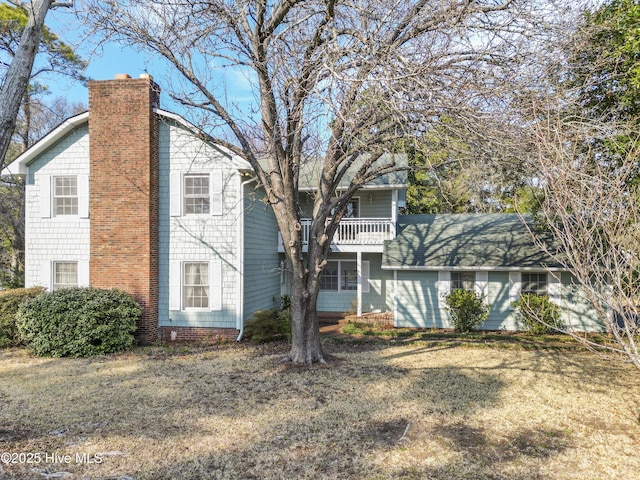 view of front of home featuring a chimney