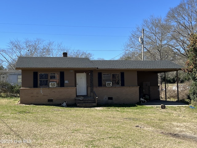 view of front of house with crawl space, roof with shingles, a front lawn, and brick siding