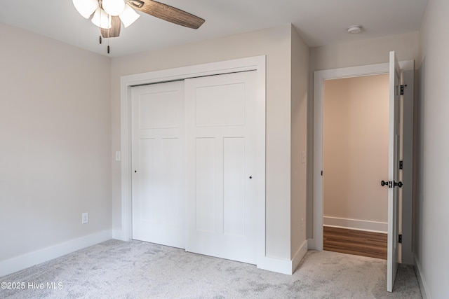 unfurnished bedroom featuring a closet, carpet, and baseboards