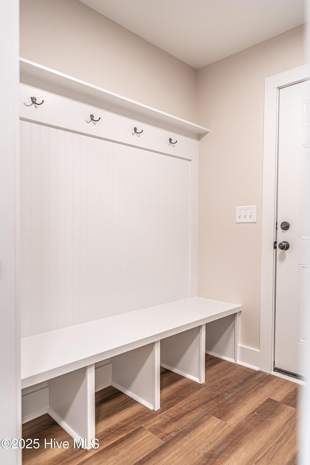 mudroom with baseboards and wood finished floors