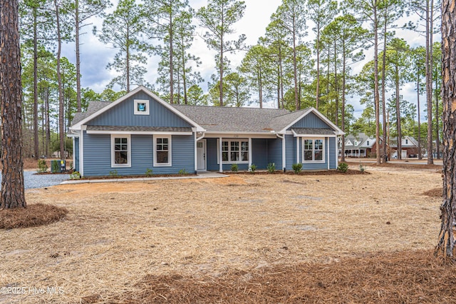 view of front of home with a shingled roof