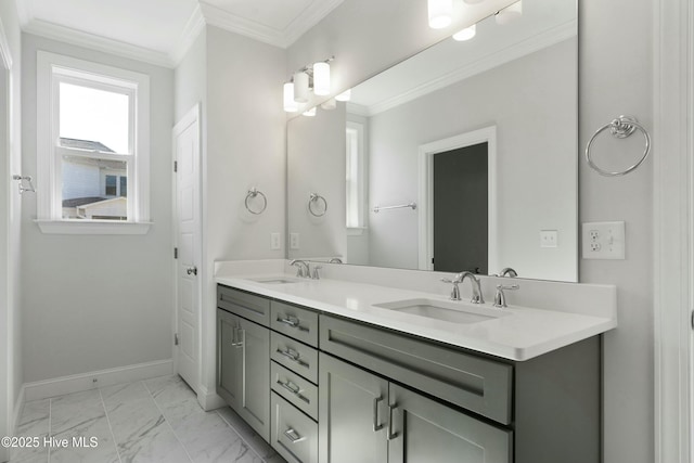 full bathroom featuring marble finish floor, baseboards, ornamental molding, and a sink