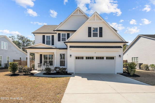 craftsman-style home featuring a porch, central air condition unit, a garage, fence, and concrete driveway