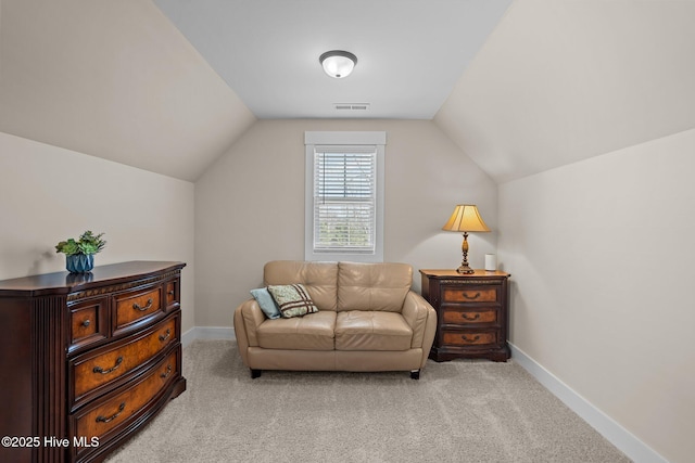 living area featuring light carpet, baseboards, visible vents, and vaulted ceiling