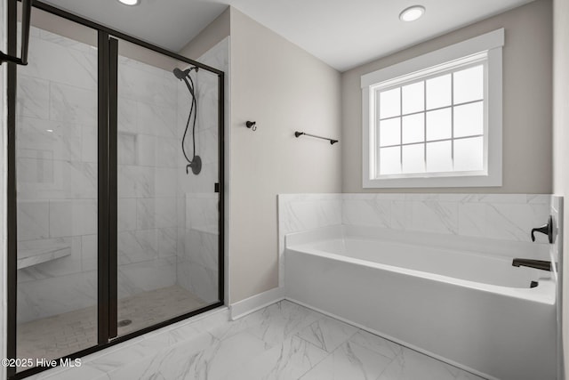 bathroom with marble finish floor, a shower stall, a bath, and recessed lighting