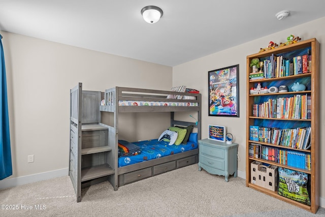 bedroom with carpet floors and baseboards