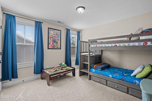 bedroom featuring carpet, visible vents, and baseboards