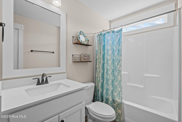 full bath featuring shower / bathtub combination with curtain, vanity, and toilet