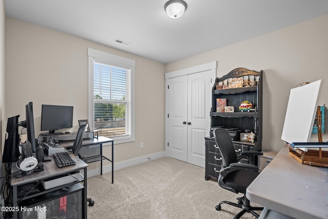 office with carpet, visible vents, and baseboards