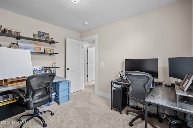 home office featuring carpet flooring and baseboards