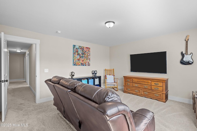 living area featuring light colored carpet and baseboards