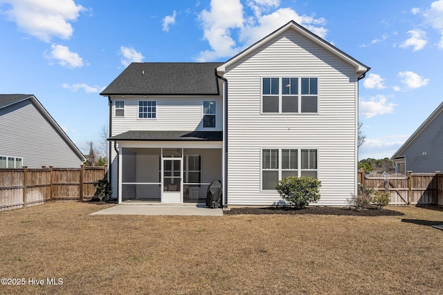 back of property featuring a yard, a sunroom, a fenced backyard, and a patio