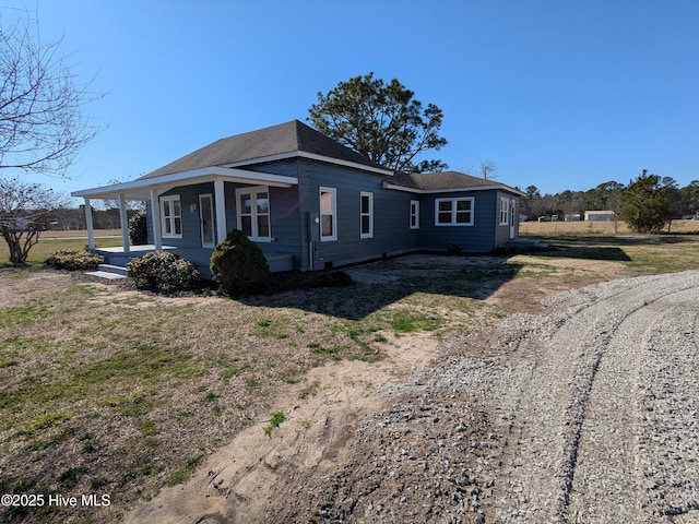 view of front facade featuring a carport and covered porch