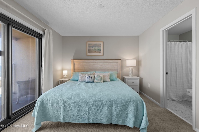 carpeted bedroom with a textured ceiling and baseboards