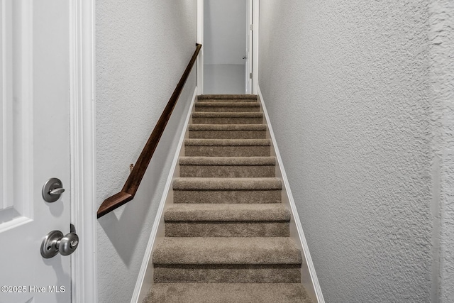 stairs with a textured wall