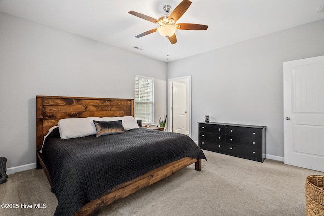 carpeted bedroom featuring visible vents, ceiling fan, and baseboards