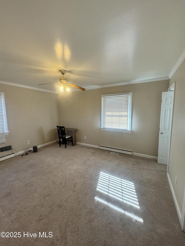 unfurnished bedroom featuring carpet, baseboards, baseboard heating, and crown molding