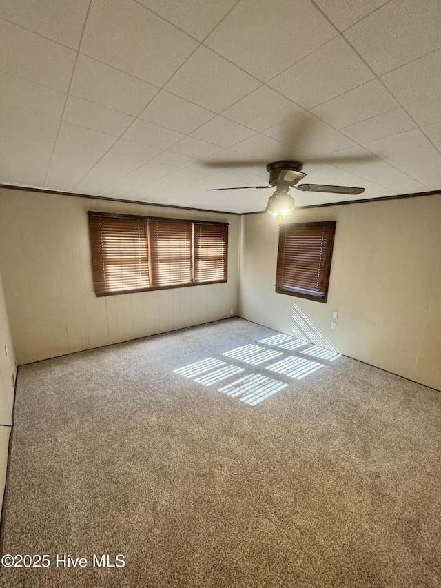 carpeted empty room with ceiling fan