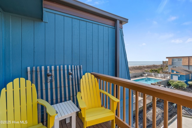 balcony featuring a water view