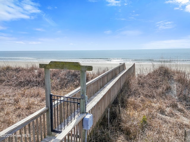 exterior space with a beach view and a water view