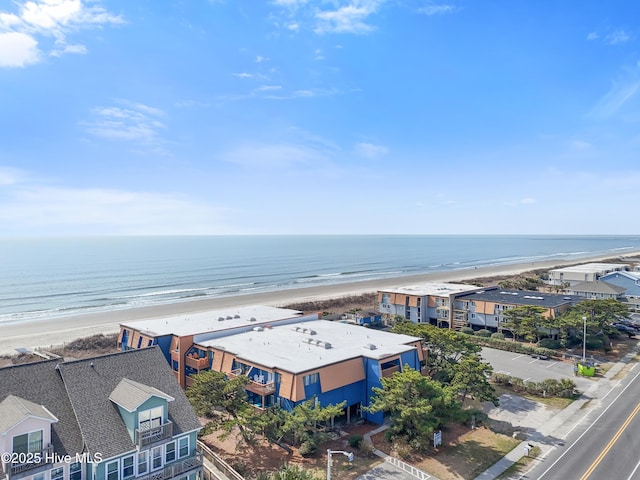 bird's eye view with a water view and a view of the beach