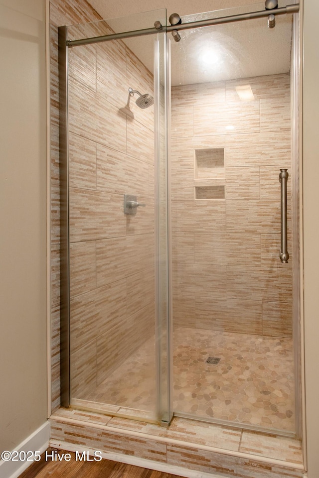 bathroom featuring a shower stall