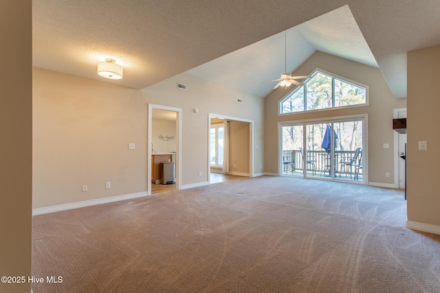 unfurnished living room featuring light carpet, high vaulted ceiling, baseboards, and visible vents