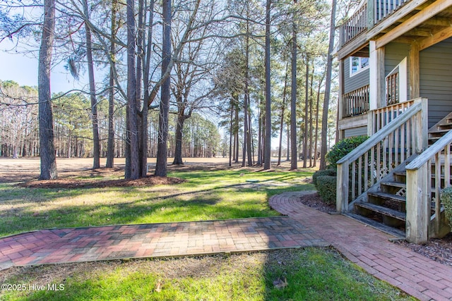 view of yard featuring stairs