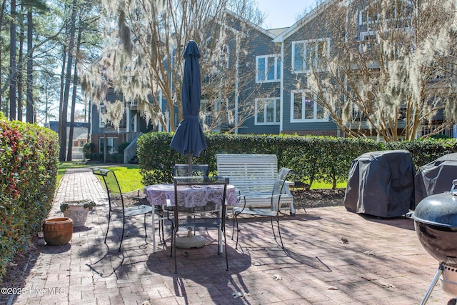 view of patio / terrace with outdoor dining area and grilling area