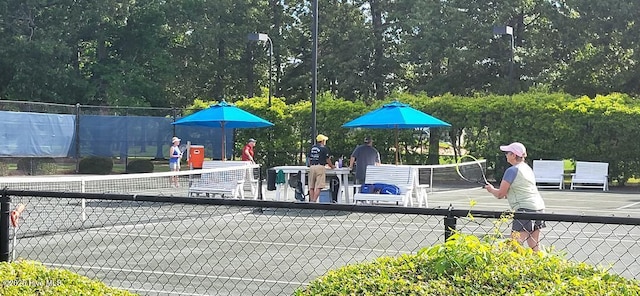 view of sport court with fence